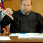 judge thumbs down
