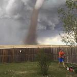 man mows lawn with tornado