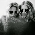 two girls with sunglasses and blanket