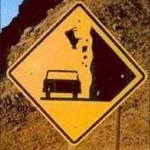 Falling animal road sign