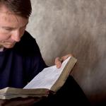 man reading bible