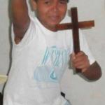 Kid Holding Cross