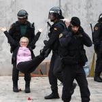 Catalonia police stop woman voting meme