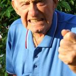 Old man holding out fist