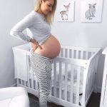 Pregnant woman in nursery | HANG IN THERE, BABY; YOU'LL BE OUT SOON | image tagged in pregnant,pregnant woman | made w/ Imgflip meme maker