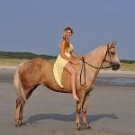 Blonde woman on horse