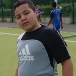 fat boy on sports ground