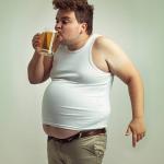 fat guy drinking
