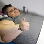 obese man thumbs up