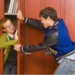 bully shoving nerd into locker