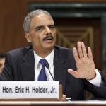 Eric Holder - 2 hand up