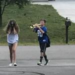 boy follows girl with trumpet meme