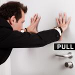 pushing a pull door
