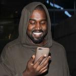 Kayne Smiling At Phone