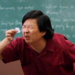 asian trying to read tiny note