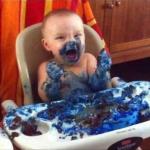 Baby eats blue cake