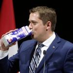 Andrew Scheer drinking milk like a slob