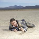 crawling man in desert