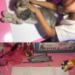 Girl drawing cat