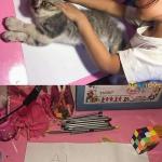 Girl tracing cat