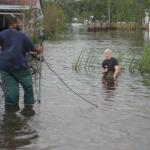 CNN's Anderson Cooper on knees in water