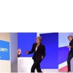 Theresa May walking confidently