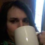 trans woman drinking coffee