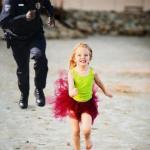 little girl runs from cop