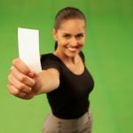 Woman holding up piece of paper