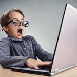 Shocked kid on computer