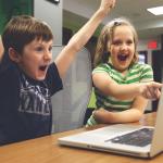 Excited happy kids pointing at computer monitor meme