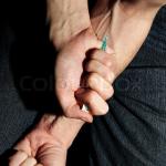 Heroin needle in arm