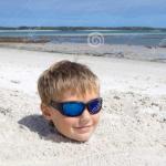 Boy buried in sand meme