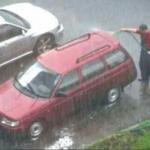 Washing car in rain