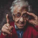 old woman with glasses pointing finger meme