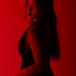 Sexy woman in red lighting