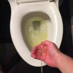 Peeing in hand