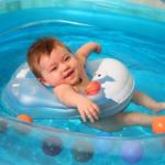 kid hanging in the swimming pool