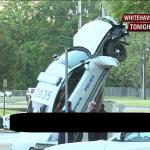 Police Car up a pole crashes into a pole dancing on a pole