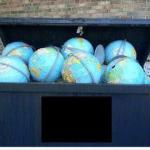 Dumpster full of earth globes meme