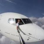 Pilot taking selfie out of plane