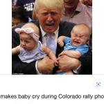 Trump holding baby