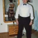 kinky man in business suit in front of mirror