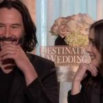 Winona looking at Keanu