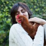 Woman with pet chicken