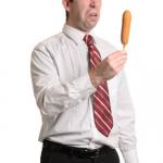 man disgusted by corn dog