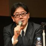 Akimoto Yasushi with mic