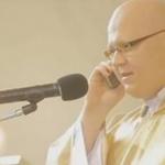 Priest talking on the phone