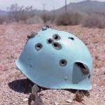 Bullet holes in blue helmet