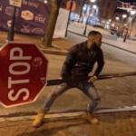 Guy holding stop sign